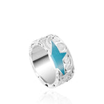 The picture shows a 925 sterling silver star matching ring with hand engravings and a turquoise gemstone.