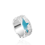 The picture shows a 925 sterling silver star matching ring with hand engravings and a turquoise gemstone.