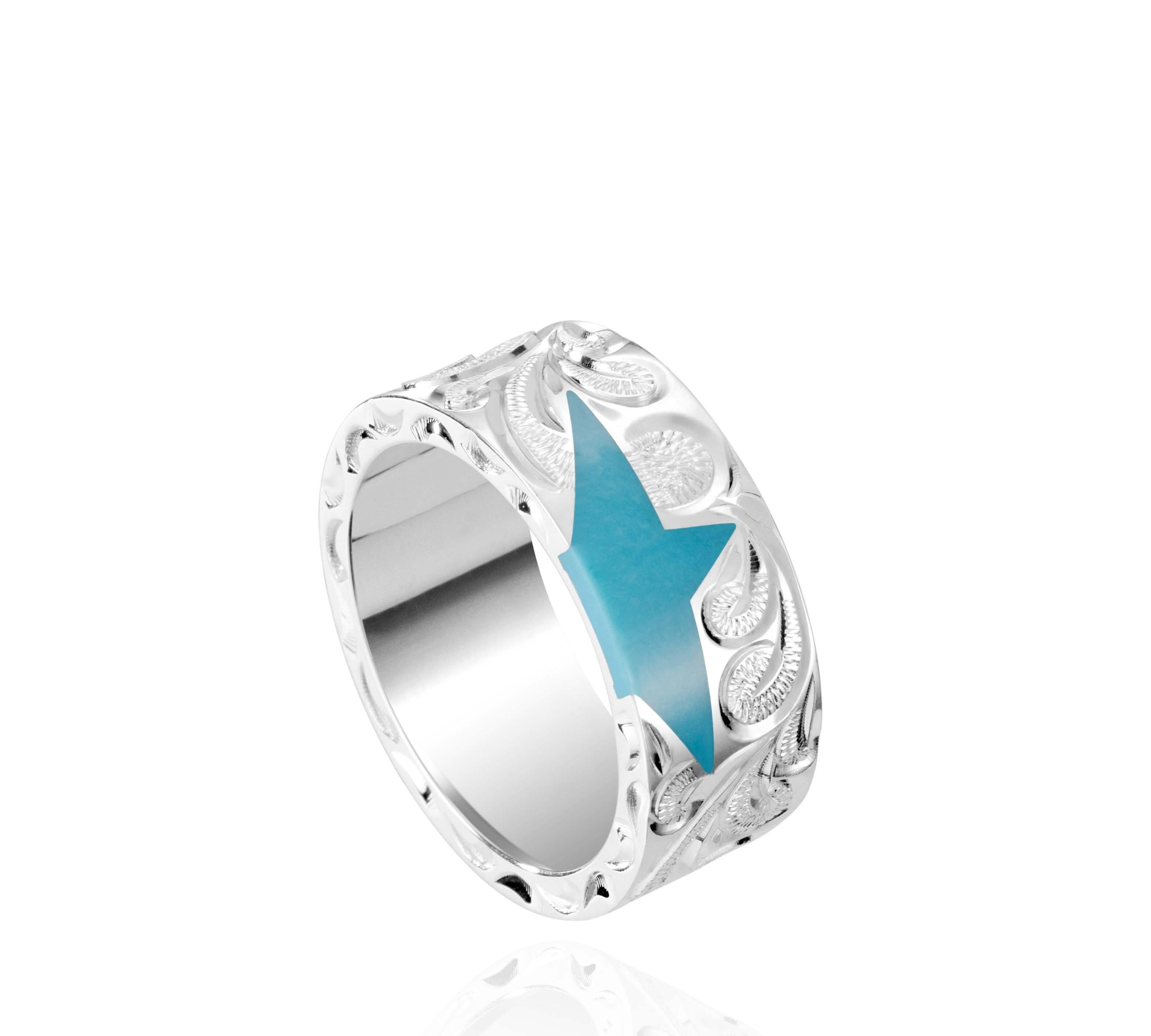 The picture shows a 925 sterling silver star matching ring with hand engravings and a turquoise gemstone.