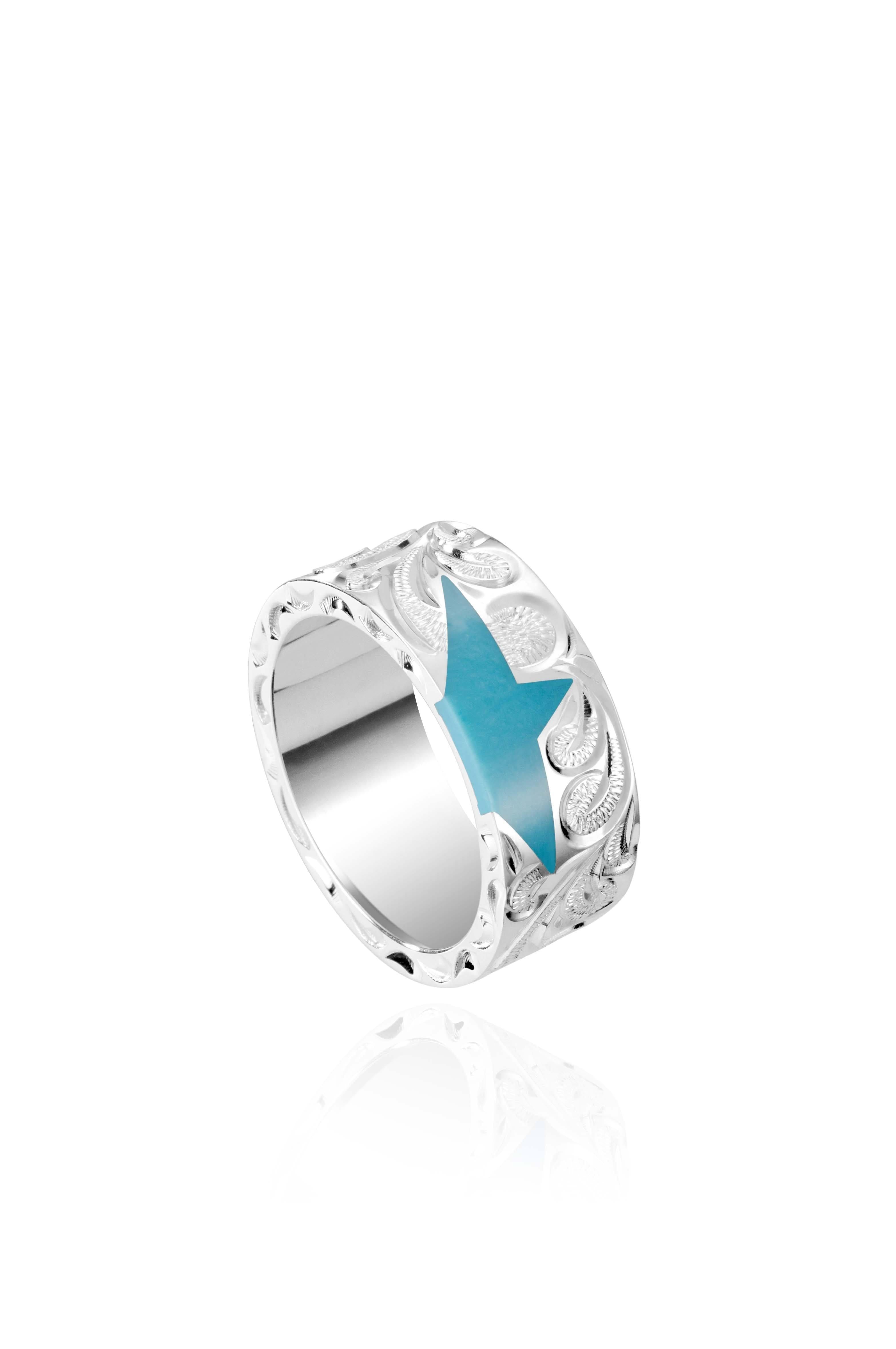 The picture shows a 925 sterling silver star matching ring with hand engravings and a turquoise gemstone.