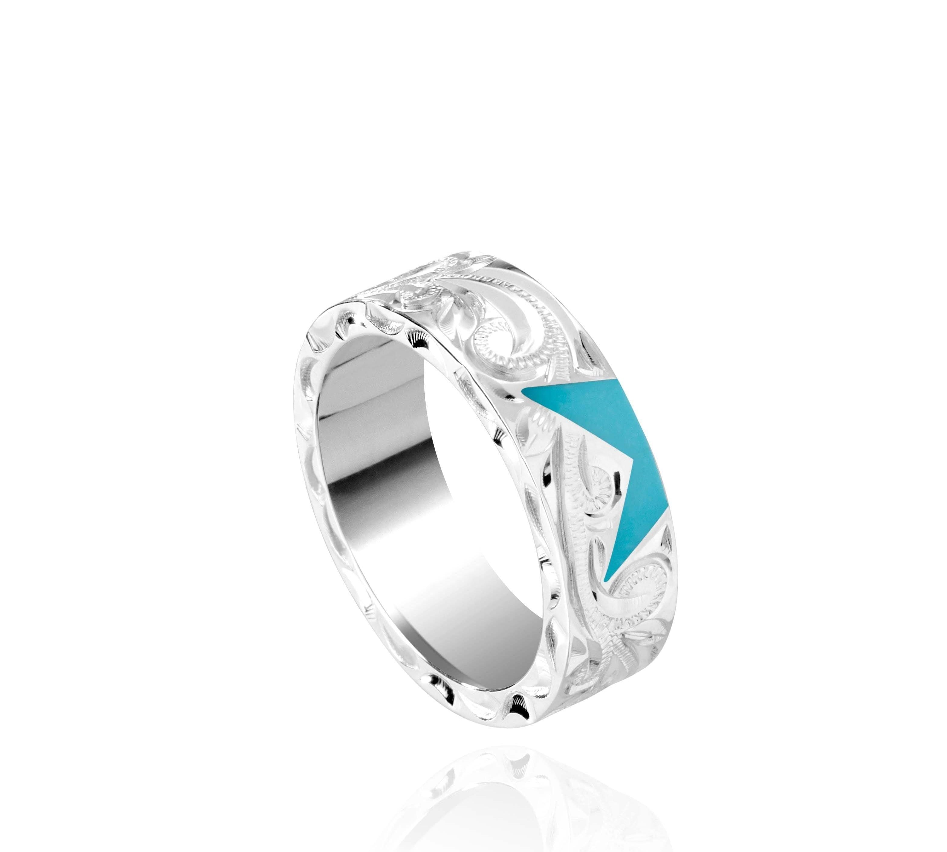 The picture shows a 925 sterling silver star matching ring with hand engravings and a turquoise gemstone.