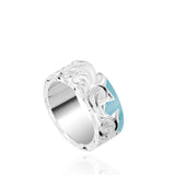 The picture shows a part of a set 925 sterling silver left half cross ring with hand-engravings and a turquoise gemstone.