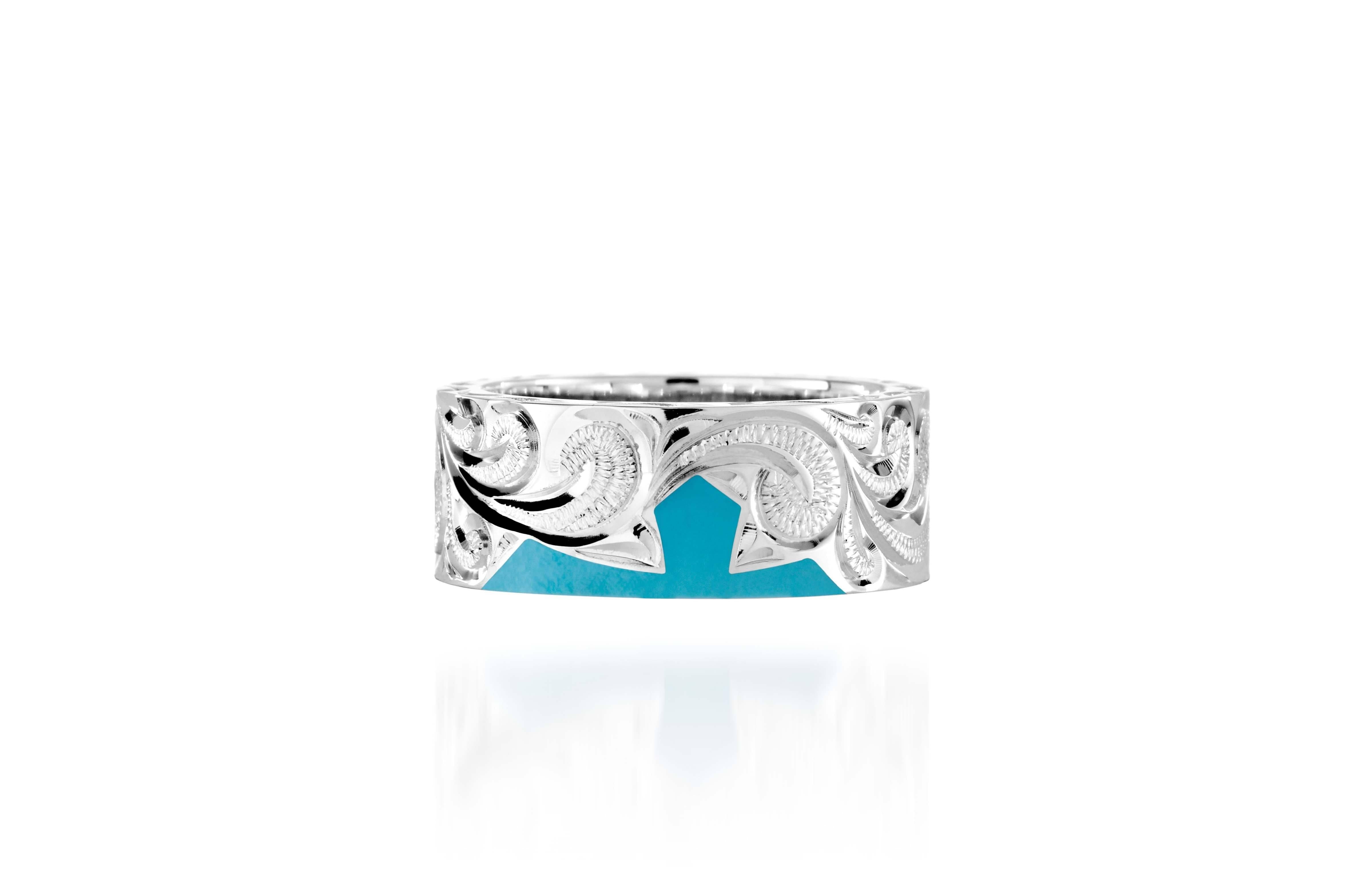 The picture shows a part of a set 925 sterling silver left half cross ring with hand-engravings and a turquoise gemstone.