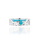 The picture shows a part of a set 925 sterling silver right half cross ring with hand-engravings and a turquoise gemstone.