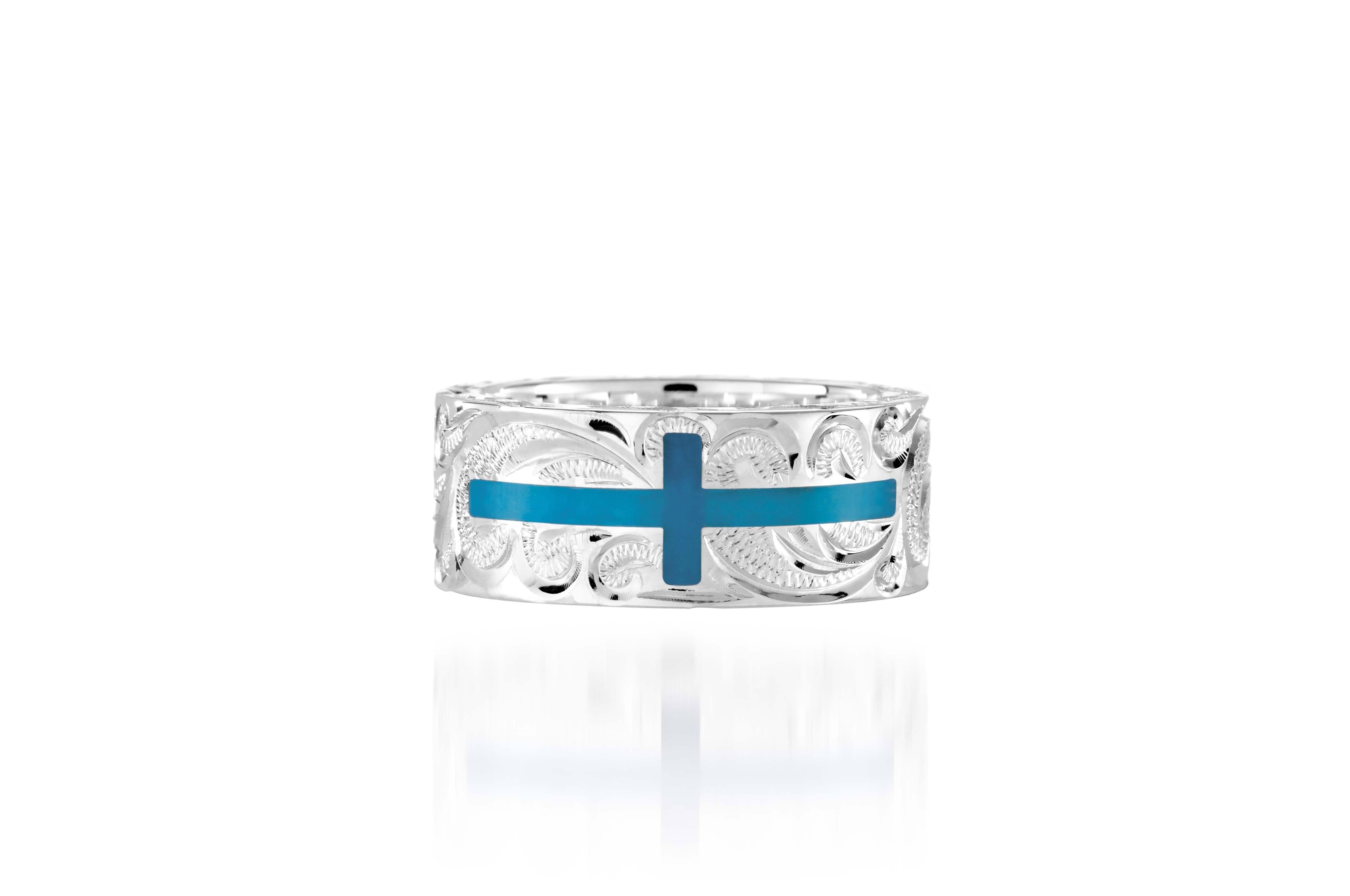 The picture shows a 925 sterling silver and turquoise cross ring with hand engravings.