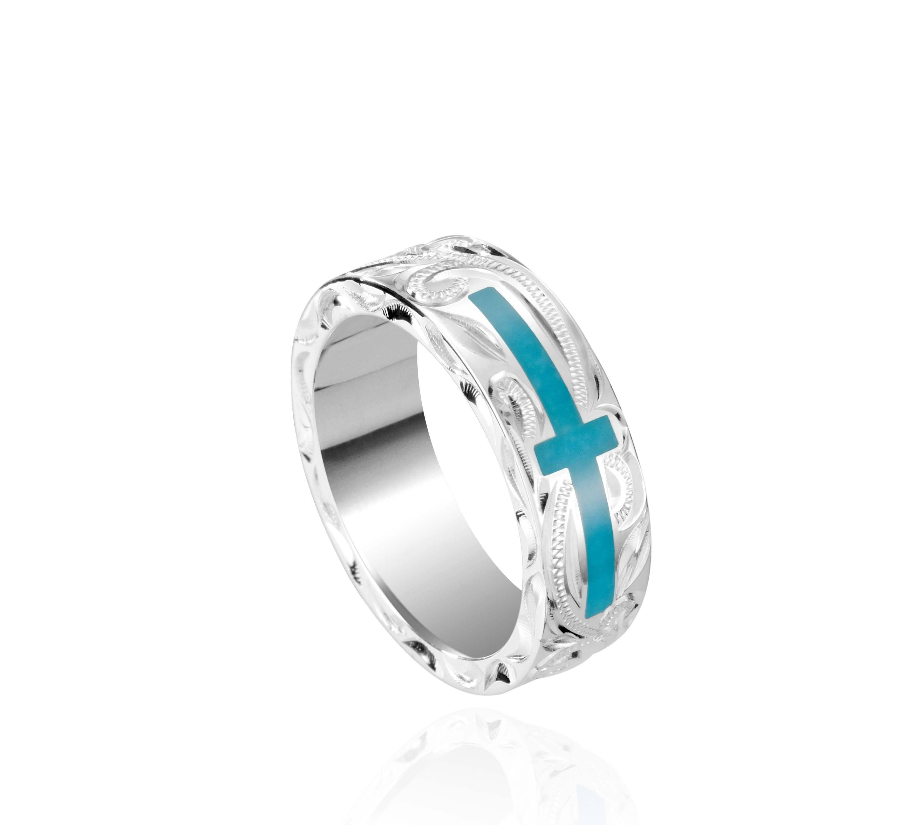 The picture shows a 925 sterling silver and turquoise cross ring with hand engravings.