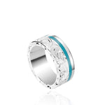 The picture shows a 925 sterling silver and turquoise wave channel ring with hand engravings.
