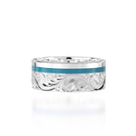 The picture shows a 925 sterling silver and turquoise wave channel ring with hand engravings.