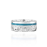 The picture shows a 925 sterling silver and turquoise wave channel ring with hand engravings.