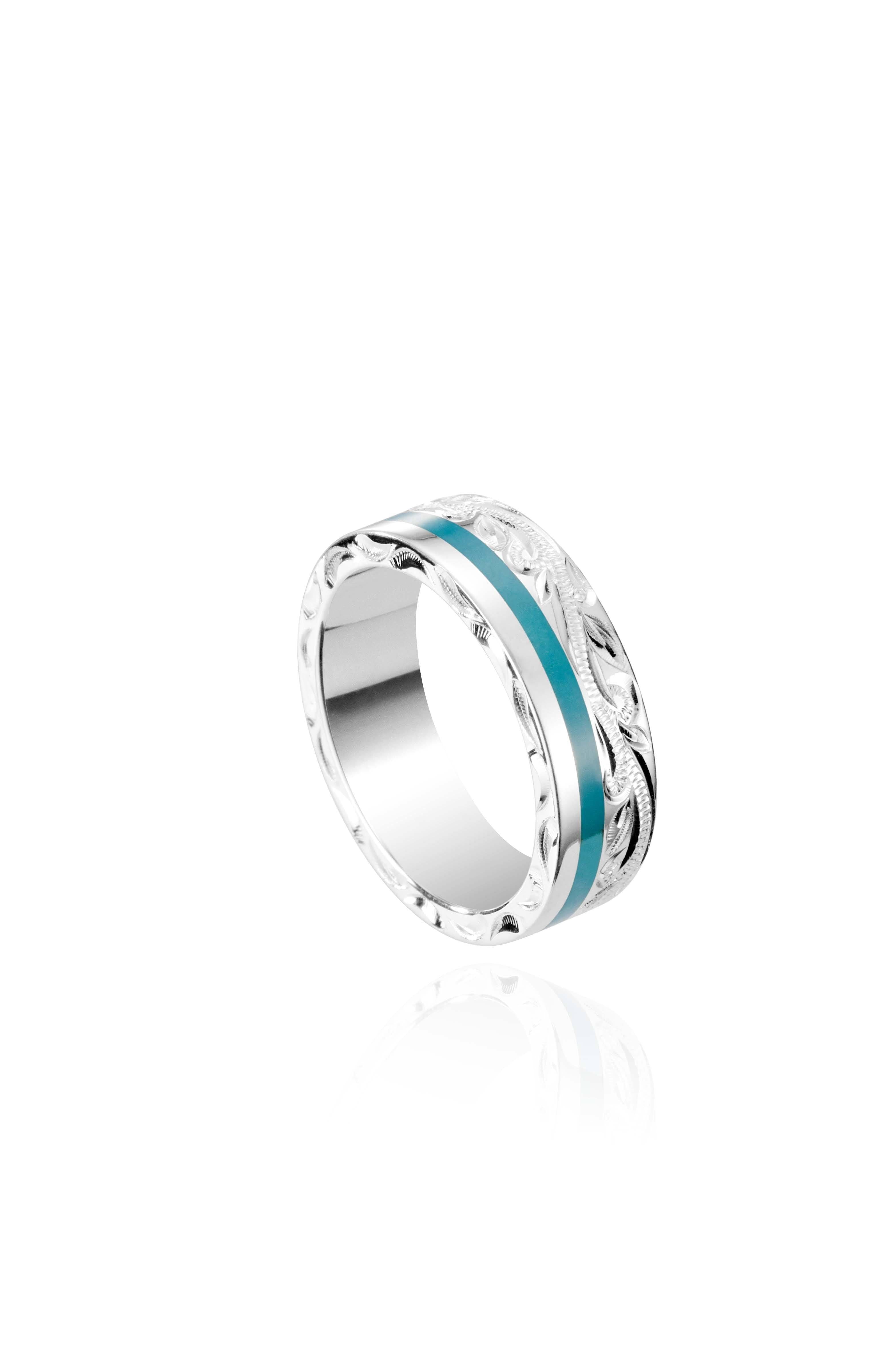 The picture shows a 925 sterling silver and turquoise wave channel ring with hand engravings.