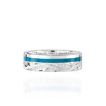 The picture shows a 925 sterling silver and turquoise wave channel ring with hand engravings.