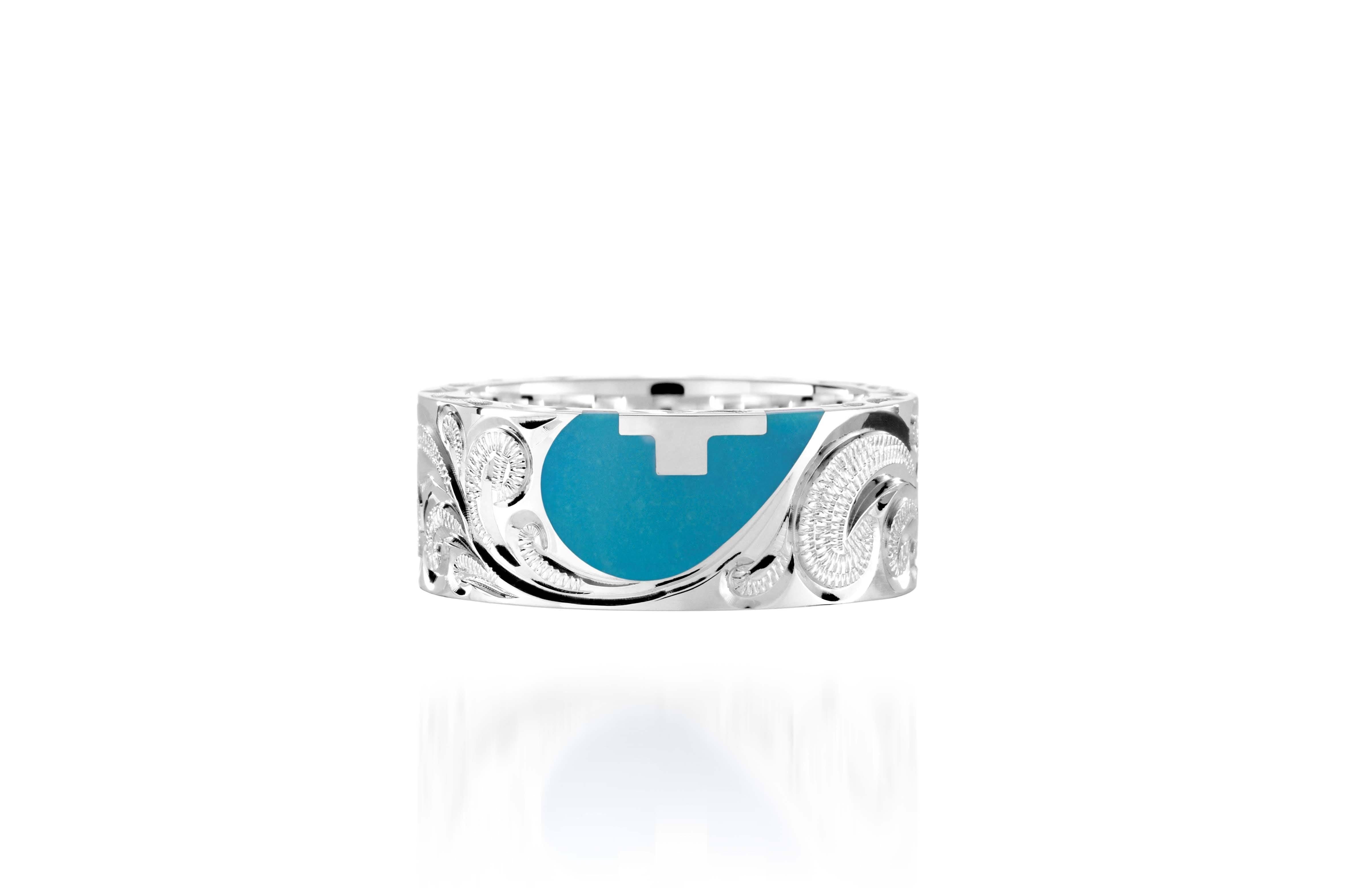 The picture shows a 925 sterling silver and turquoise heart with a cross matching ring with hand engravings.
